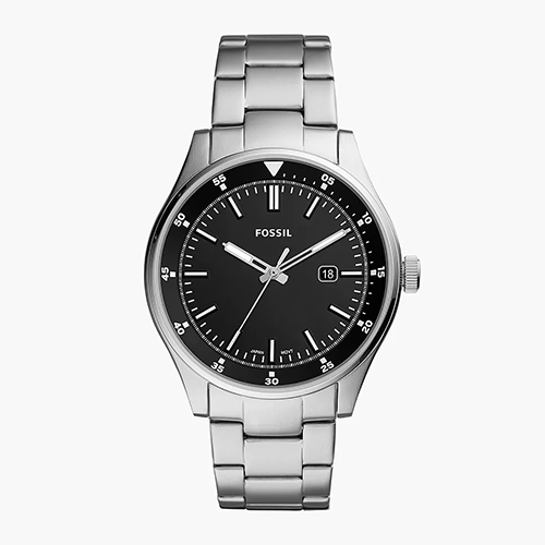 Fossil watch with black dial and silver metal strap on a white background